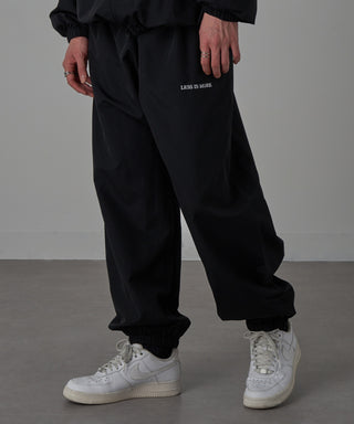 One Point Embroidery Nylon Track Pants Set-up Compatible LESS IS MORE
